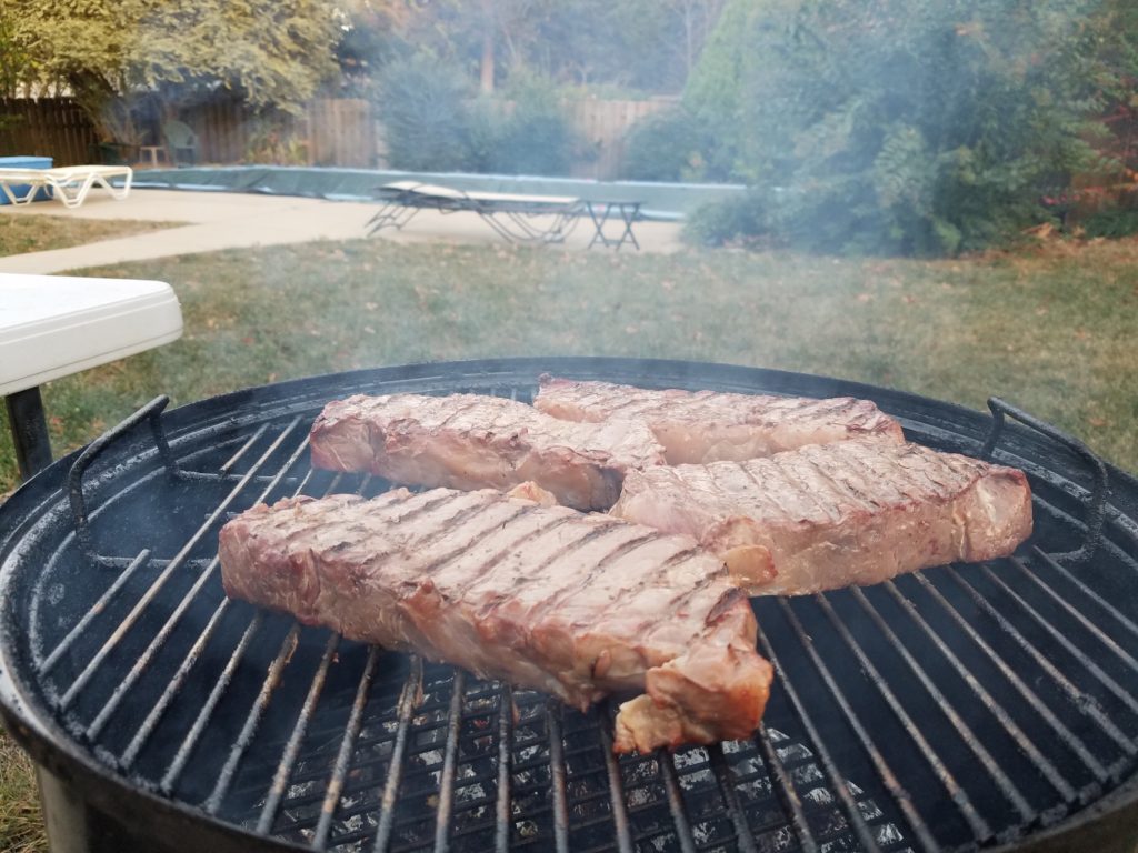 Strip steaks flipped at the 25 minute mark