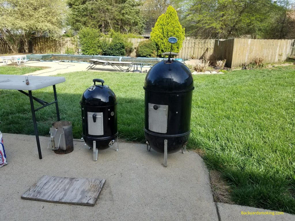 The 18-inch and 14-inch Weber Smokey Mountains running side by side