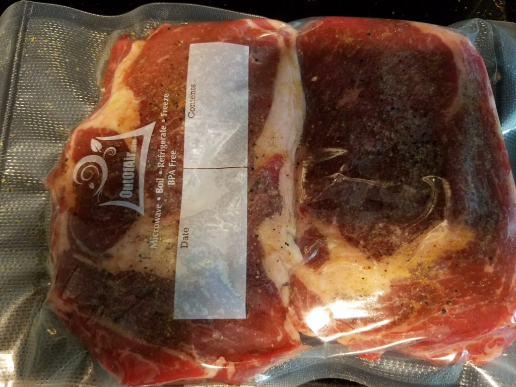 Ribeyes seasoned and sealed for sous vide