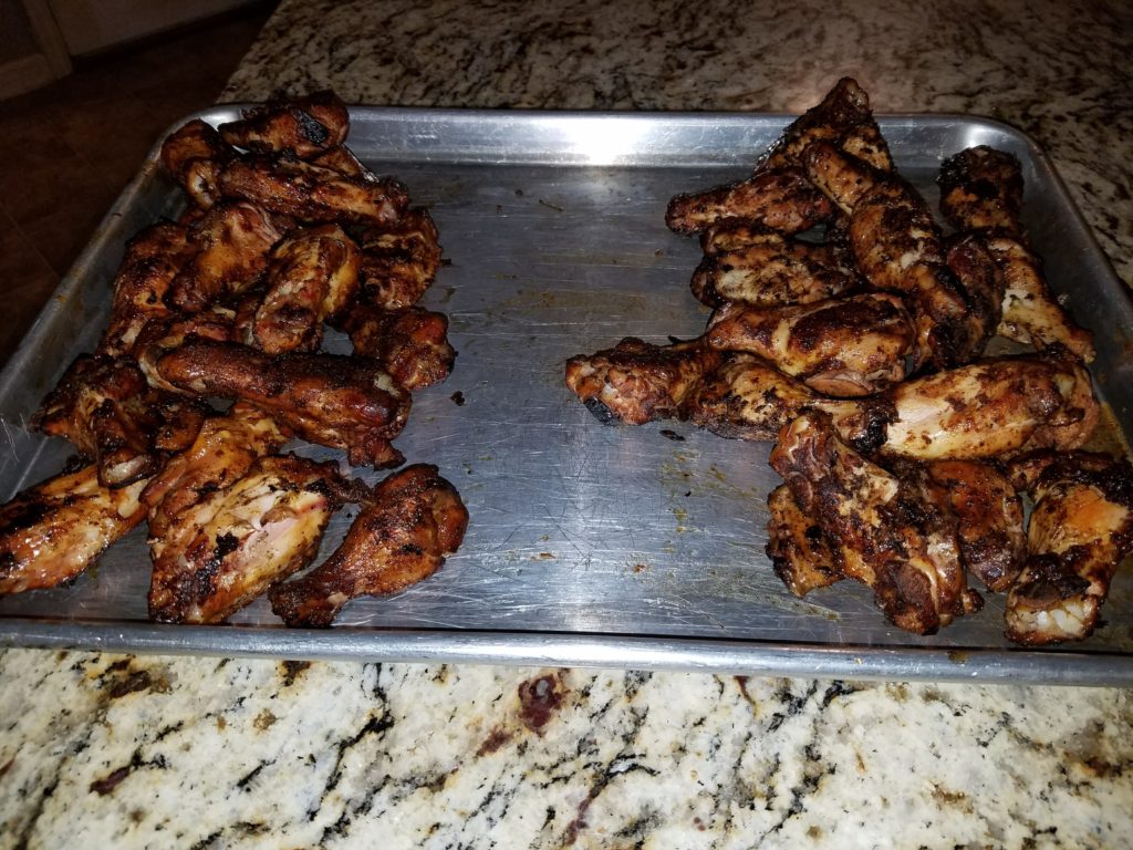Both batches of finished wings, plated side by side for comparison