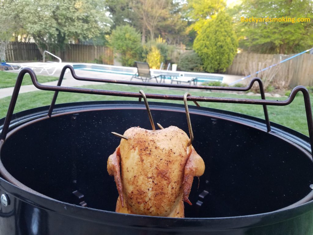 Smoked chicken hung in Weber Smokey Mountain