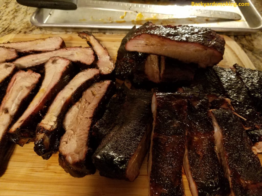 First attempt at hanging St. Louis style ribs, sliced but slightly undercooked
