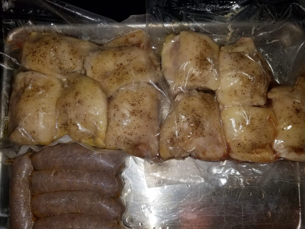 Chicken thighs and Italian sausage, seasoned and vacuum-sealed after the sous vide bath