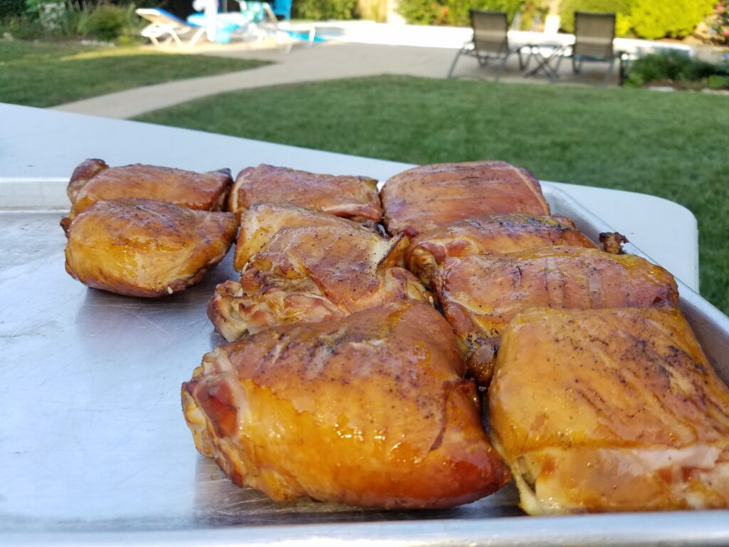 Ten chicken thighs pulled from the smoker, staged for the finish test