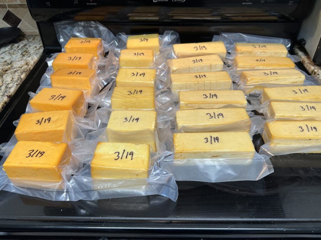 Vacuum-sealed smoked cheese labeled with the smoking date